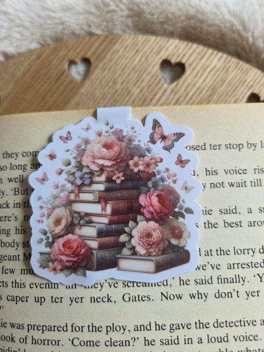 Magnetic bookmark, roses and butterfly's on a stack of books