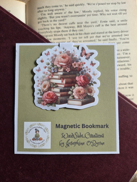 Magnetic bookmark, roses and butterfly's on a stack of books