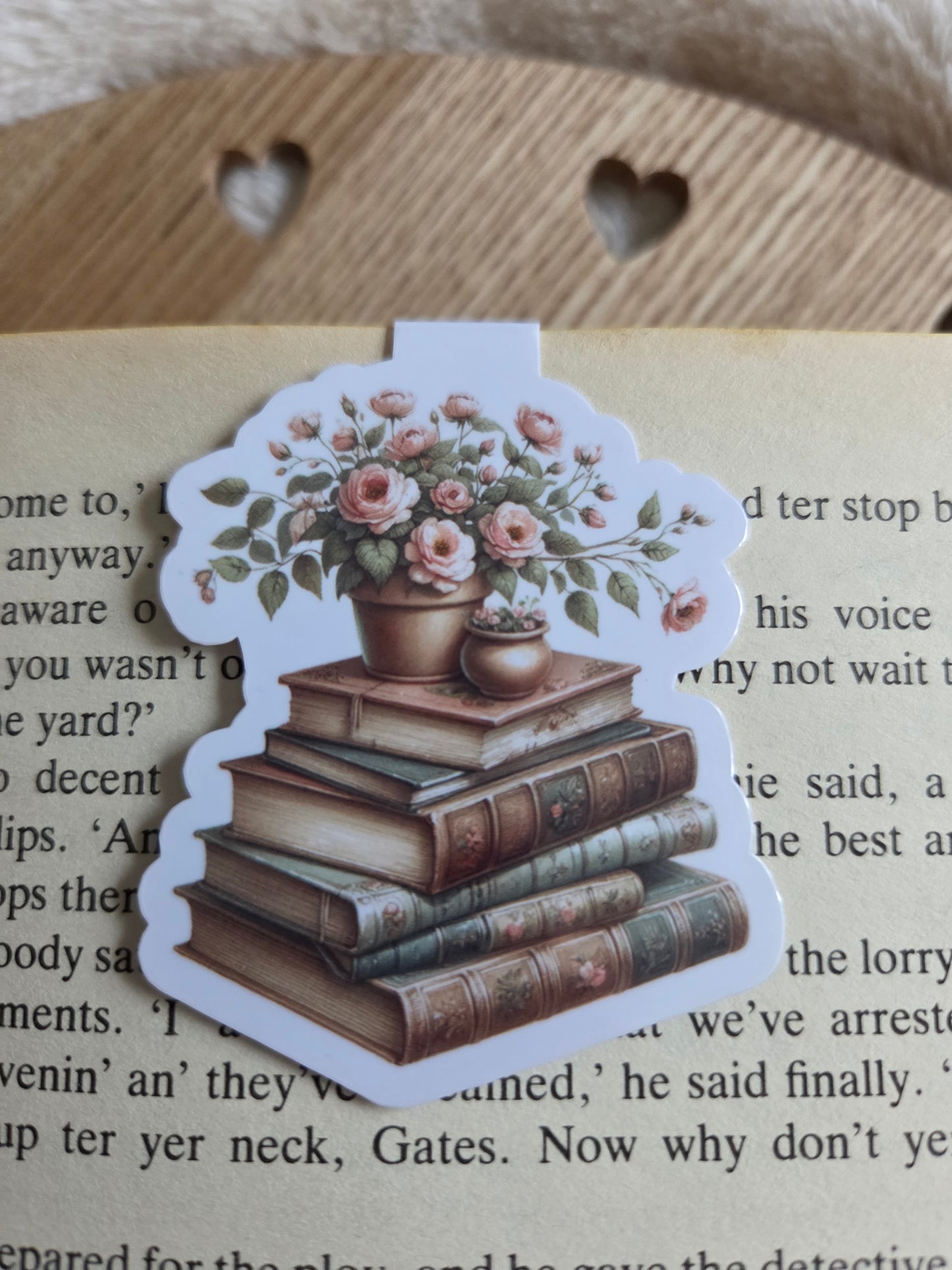 Magnetic bookmark, flowers on a stack of books