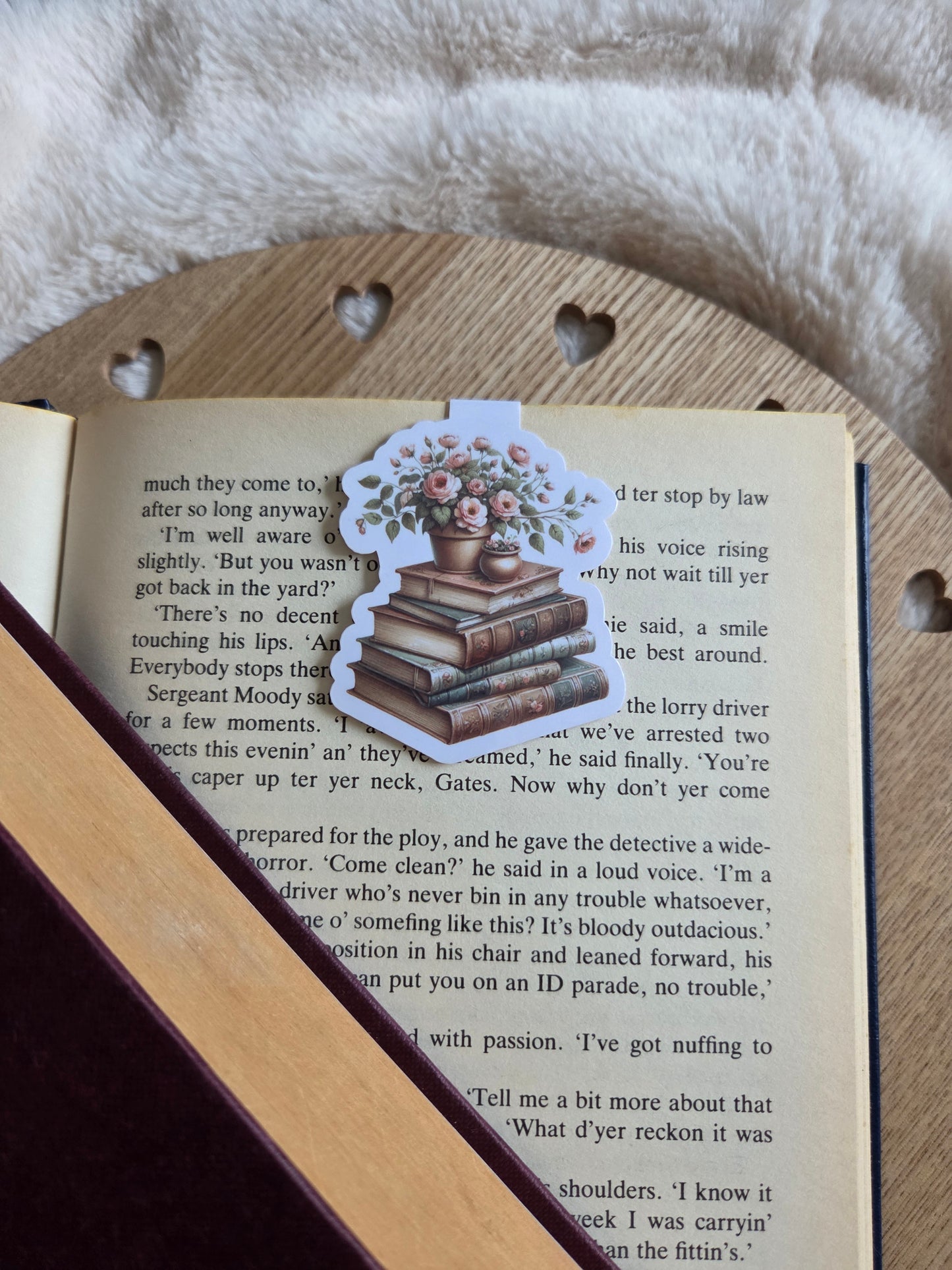 Magnetic bookmark, flowers on a stack of books