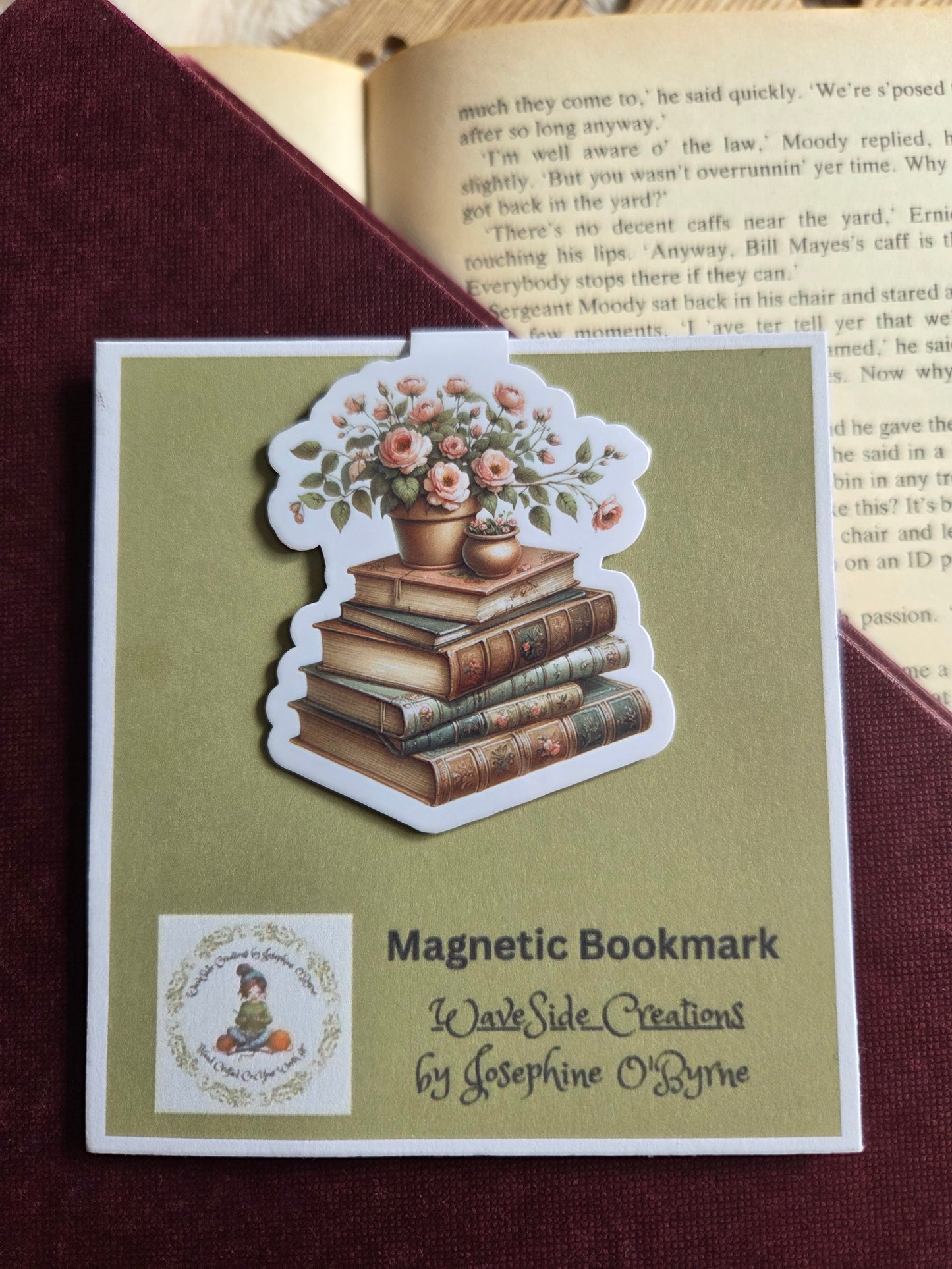 Magnetic bookmark, flowers on a stack of books