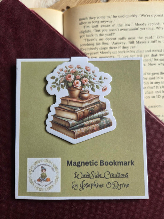 Magnetic bookmark, flowers on a stack of books