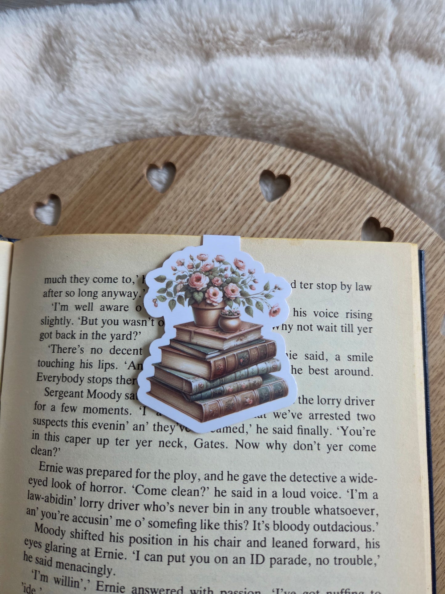 Magnetic bookmark, flowers on a stack of books